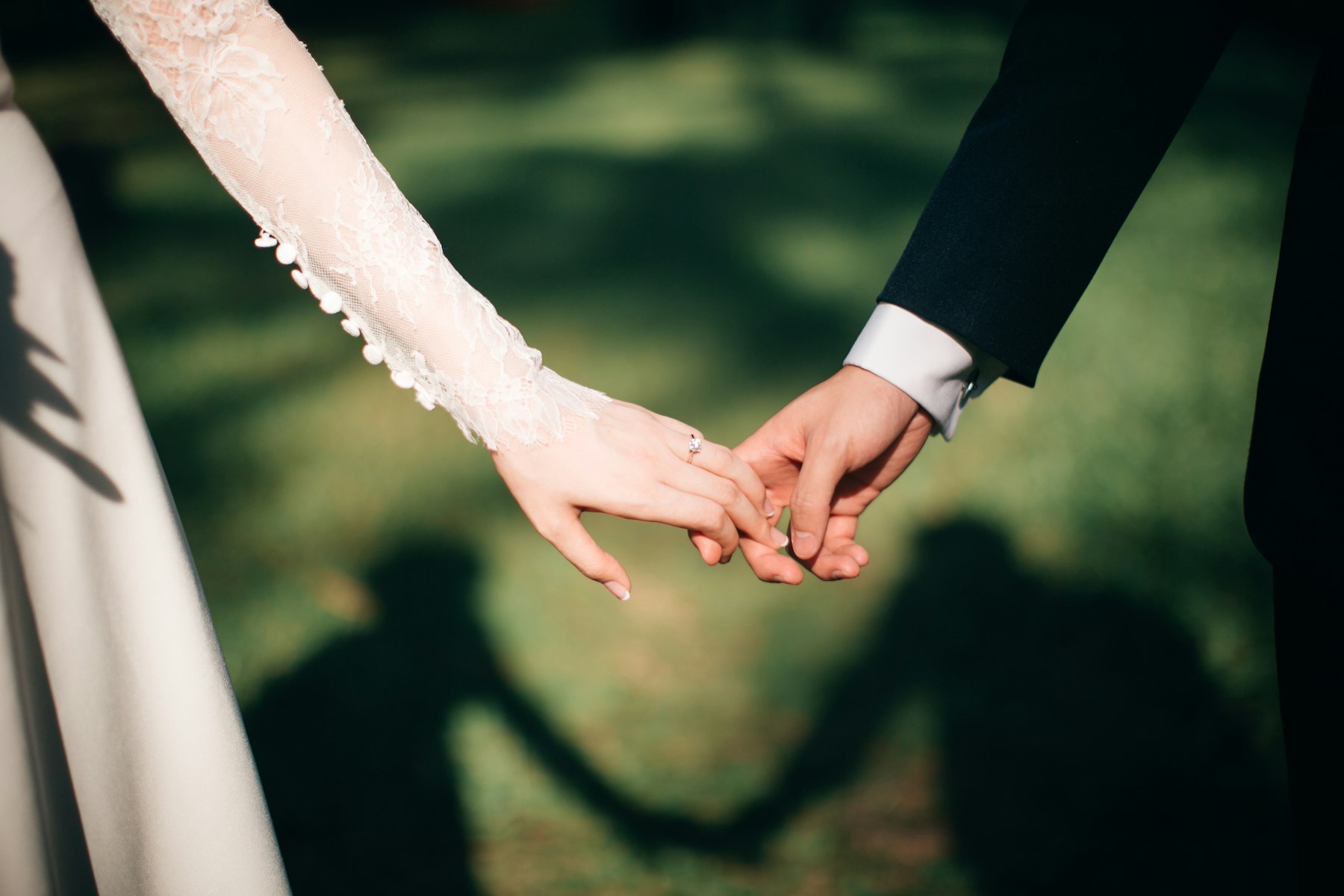 A couple holding hands on their marriage day